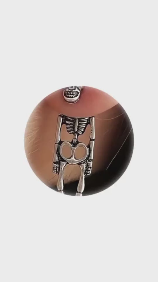 Skull simulation earrings highlighting detailed craftsmanship and quality